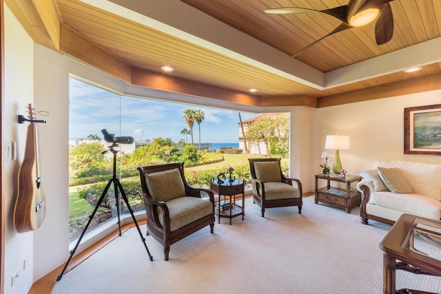 interior space featuring wood ceiling, ceiling fan, and a water view