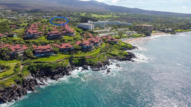 bird's eye view with a water and mountain view