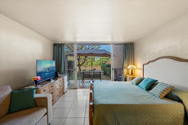 tiled bedroom with expansive windows and access to outside