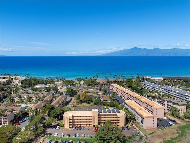 aerial view featuring a water and mountain view