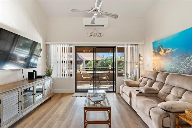 living room featuring ceiling fan, a wall mounted AC, and hardwood / wood-style flooring