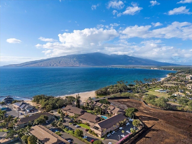 drone / aerial view with a water and mountain view