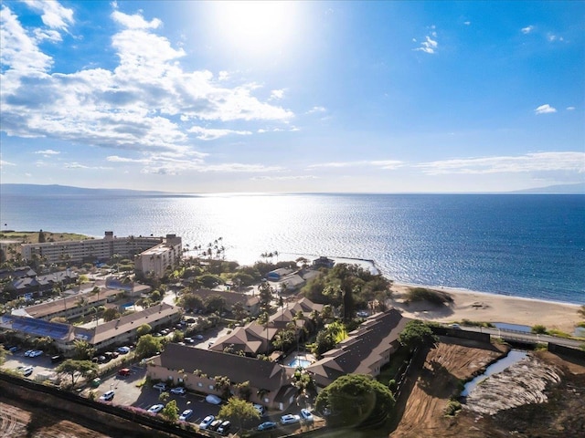 birds eye view of property featuring a water view and a view of the beach