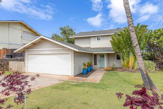 view of front facade featuring a garage and a front yard