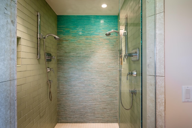 bathroom with tiled shower