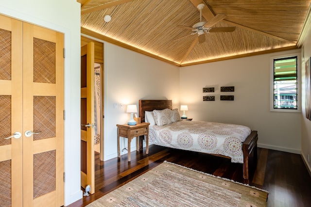 bedroom with ceiling fan, dark hardwood / wood-style floors, wood ceiling, and french doors