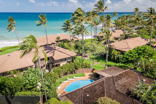 view of pool with a view of the beach and a water view