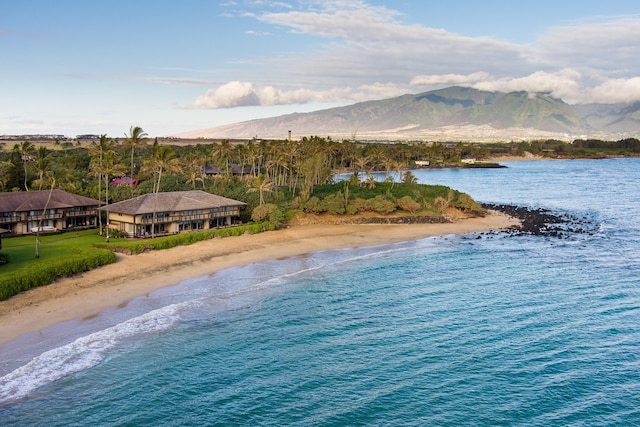 water view with a mountain view and a beach view