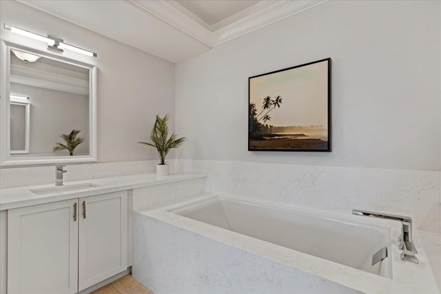 bathroom with vanity, tile patterned floors, ornamental molding, and a relaxing tiled tub