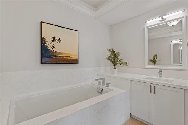 bathroom with vanity, a bathtub, ornamental molding, and tile patterned flooring