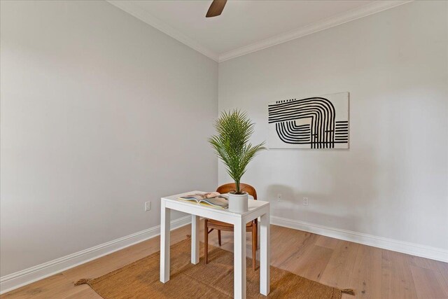 office area with hardwood / wood-style flooring, ceiling fan, and crown molding