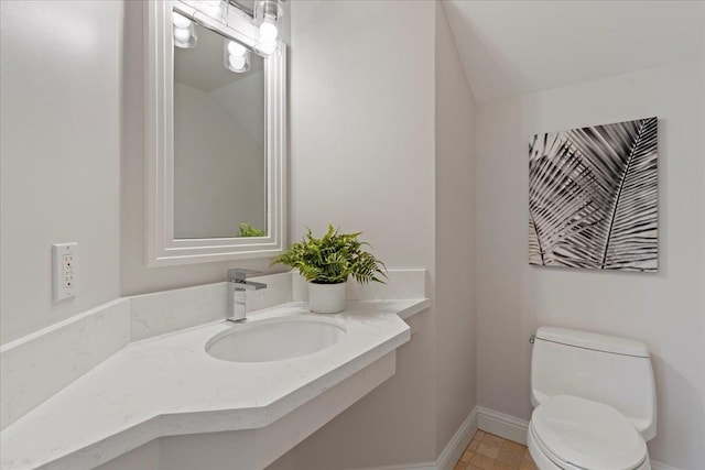 bathroom with sink and toilet