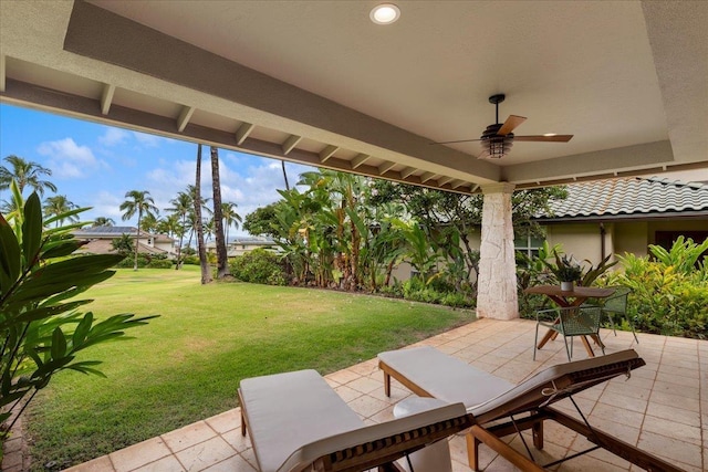 view of patio featuring ceiling fan