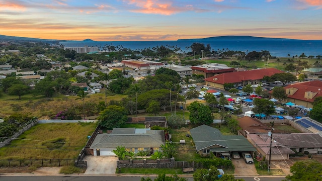 aerial view at dusk with a water view