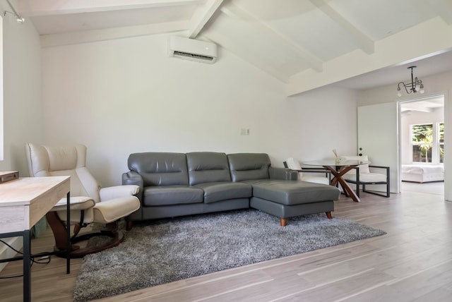 living room featuring lofted ceiling with beams, a wall mounted air conditioner, and wood finished floors
