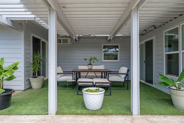 view of patio with outdoor dining area and a pergola