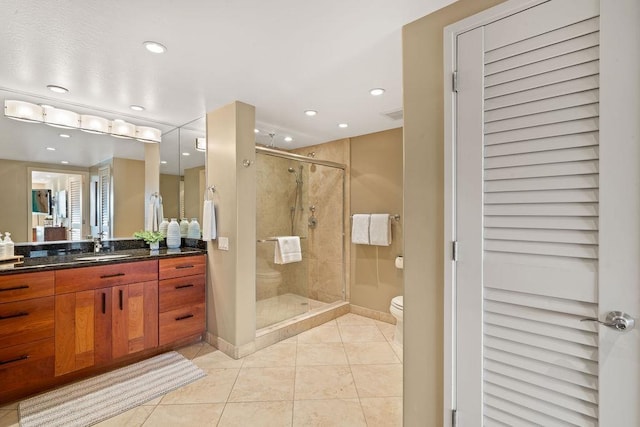 bathroom with toilet, tile patterned floors, recessed lighting, baseboards, and a stall shower