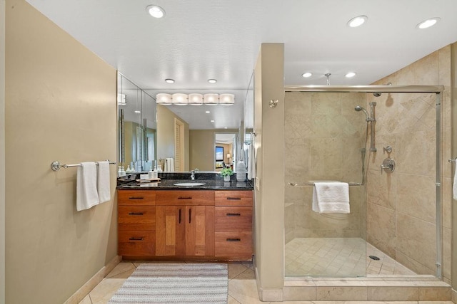 bathroom with vanity, tile patterned floors, a stall shower, and recessed lighting