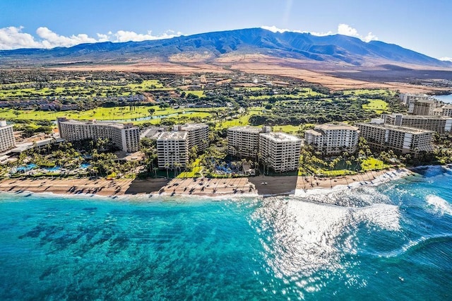 birds eye view of property featuring a beach view and a water and mountain view