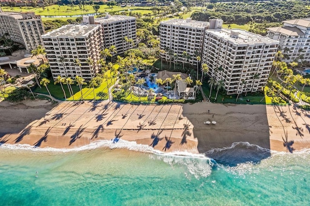 bird's eye view featuring a beach view and a water view