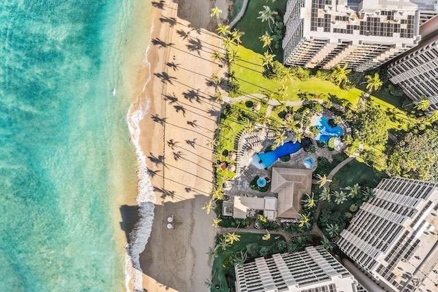 drone / aerial view with a beach view and a water view