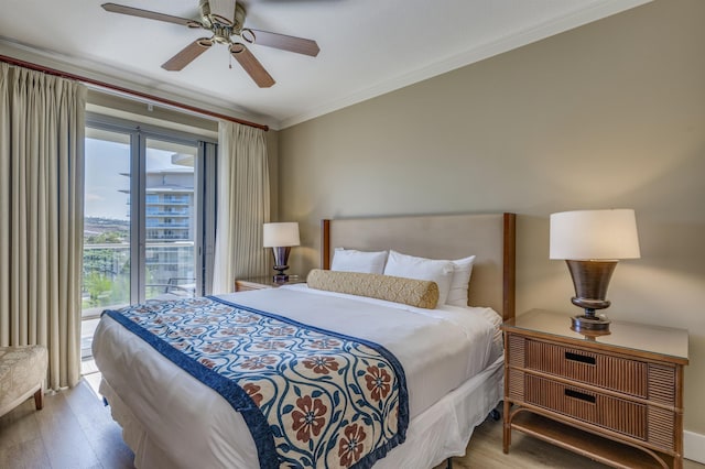 bedroom with ceiling fan, ornamental molding, and light wood-type flooring