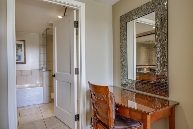 bathroom with tile patterned floors and tasteful backsplash