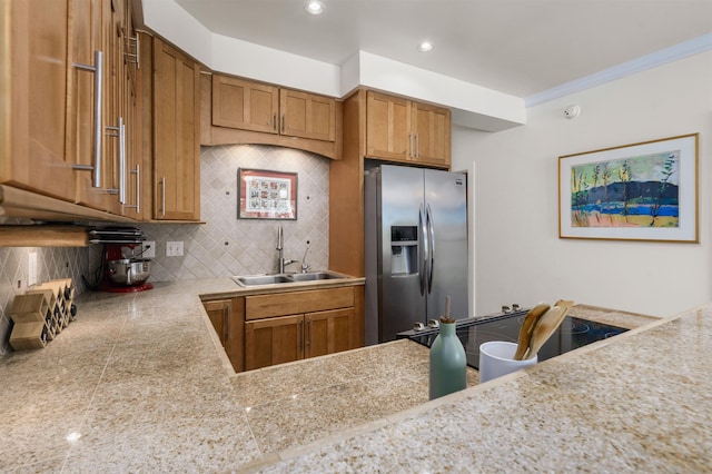 4435 Lower Honoapiilani Rd Unit 152, Lahaina, HI 96761 - kitchen featuring stainless steel fridge with ice dispenser, a sink, tile counters, decorative backsplash, and brown cabinetry