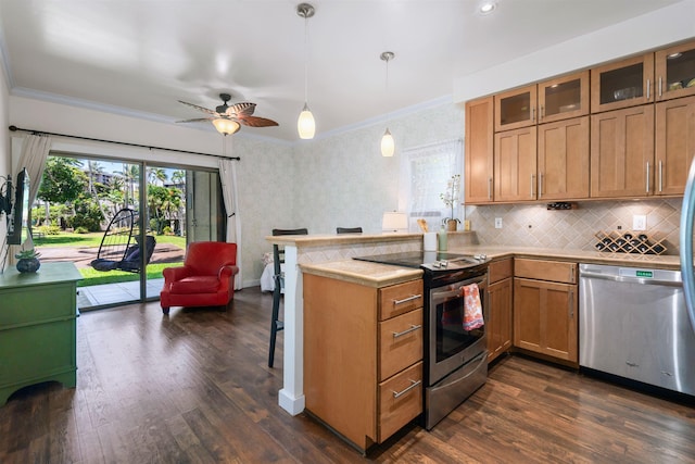 4435 Lower Honoapiilani Rd Unit 152, Lahaina, HI 96761 - kitchen featuring appliances with stainless steel finishes, a peninsula, crown molding, dark wood-style floors, and glass insert cabinets