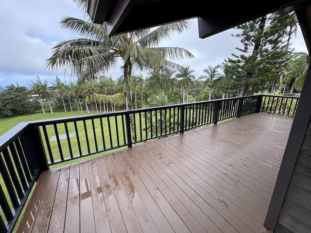 wooden deck with a yard