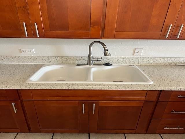 interior details with light stone counters and sink