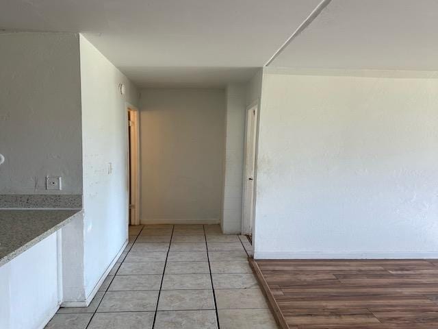 hallway featuring wood-type flooring