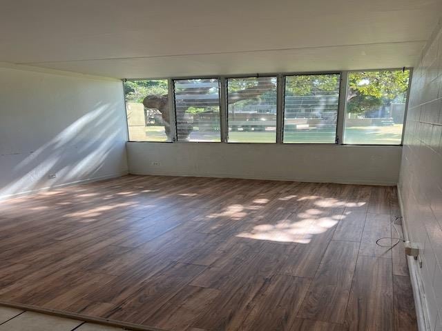 spare room featuring dark hardwood / wood-style floors