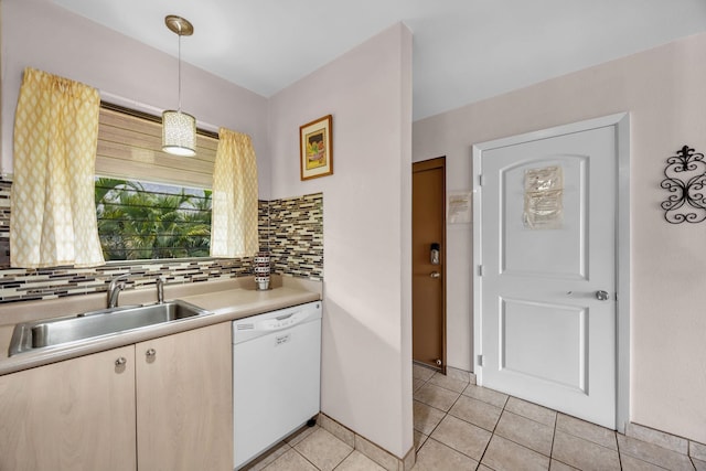 34 Wailana Pl Unit 201, Kihei, HI 96753 - kitchen featuring white dishwasher, light countertops, light tile patterned floors, backsplash, and pendant lighting