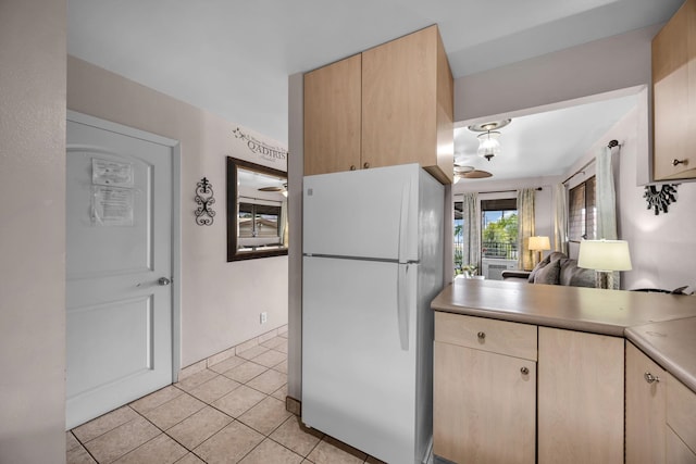 34 Wailana Pl Unit 201, Kihei, HI 96753 - kitchen featuring freestanding refrigerator, light brown cabinets, light tile patterned floors, and light countertops