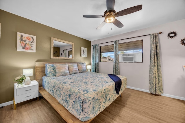 34 Wailana Pl Unit 201, Kihei, HI 96753 - bedroom featuring wood finished floors, cooling unit, and a ceiling fan