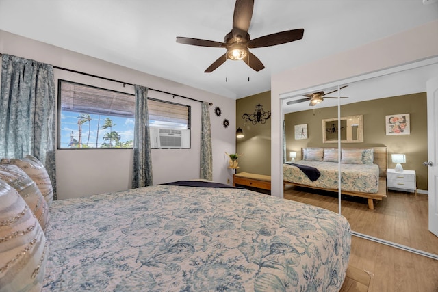 34 Wailana Pl Unit 201, Kihei, HI 96753 - bedroom featuring cooling unit, light wood-style flooring, ceiling fan, and a closet