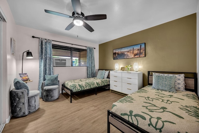 34 Wailana Pl Unit 201, Kihei, HI 96753 - bedroom featuring wood finished floors, cooling unit, and ceiling fan