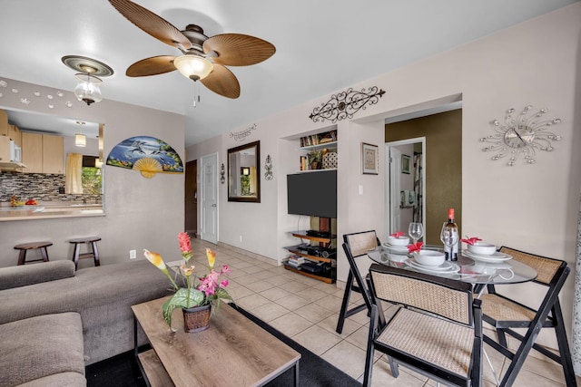 34 Wailana Pl Unit 201, Kihei, HI 96753 - living area with light tile patterned floors and a ceiling fan