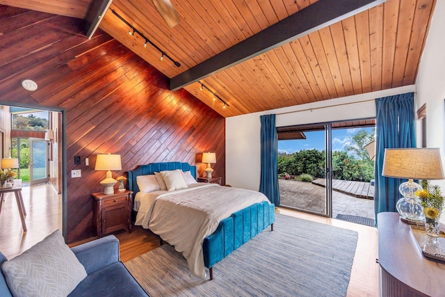 bedroom with multiple windows, access to exterior, and wooden ceiling