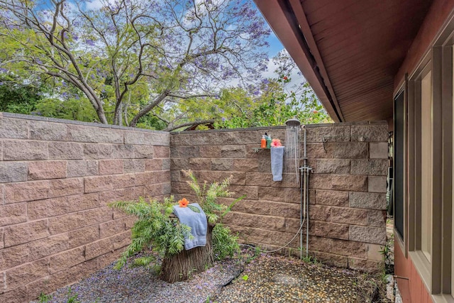 view of yard with fence and a gate