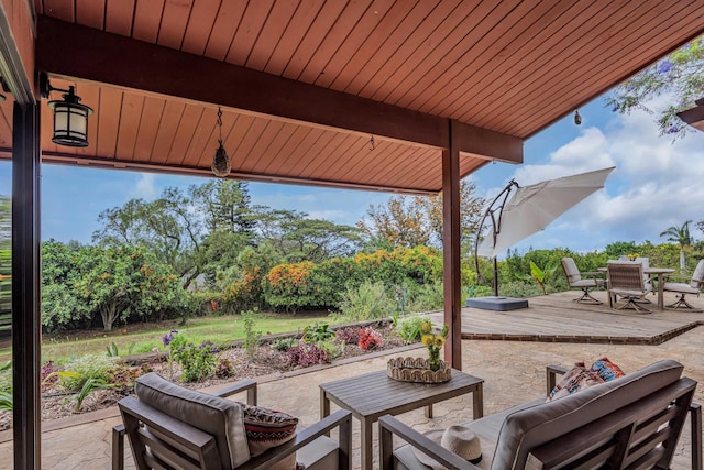view of patio / terrace featuring a deck, outdoor dining area, and an outdoor hangout area