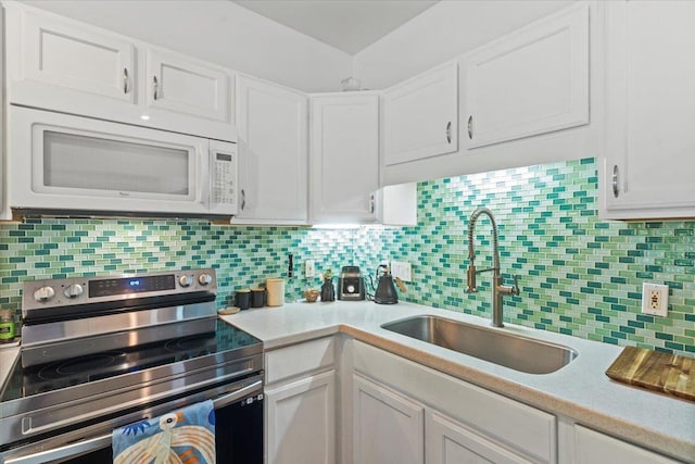 kitchen featuring white cabinetry, backsplash, stainless steel electric range oven, and sink