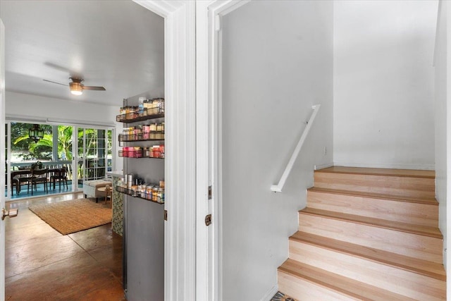 stairway with ceiling fan