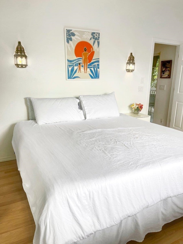 bedroom with wood-type flooring