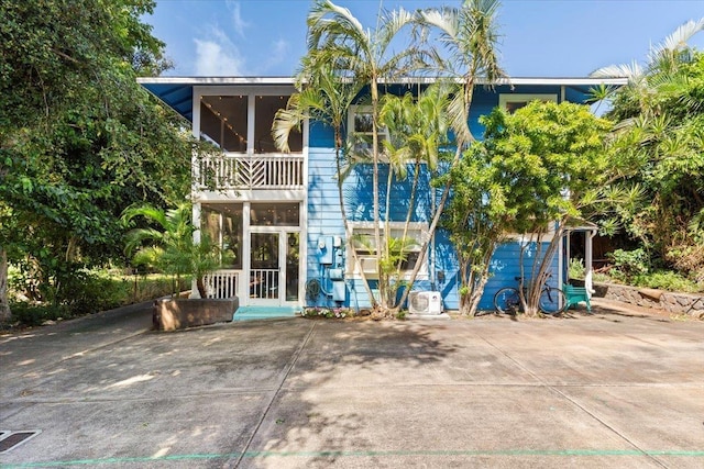 view of front of home featuring a balcony