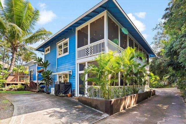 view of home's exterior featuring a sunroom