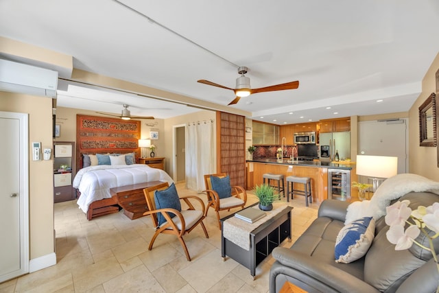 bedroom with wine cooler, sink, stainless steel fridge, and a wall mounted AC