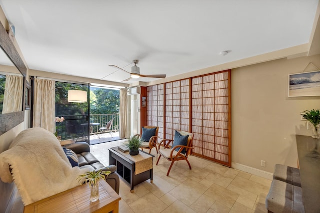 living area with ceiling fan