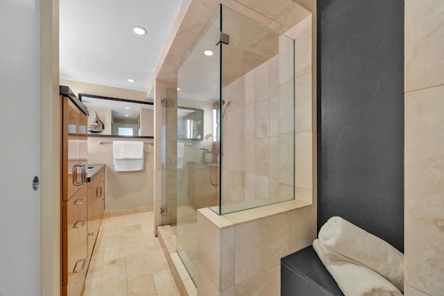 bathroom with tile patterned flooring and walk in shower